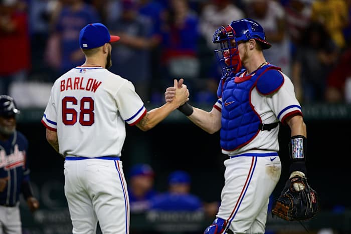 Apr 30, 2022; Arlington, Texas, USA; Texas Rangers relief pitcher Joe Barlow (68) and catcher Sam Huff (55) celebrate the win over the Atlanta Braves at Globe Life Field.